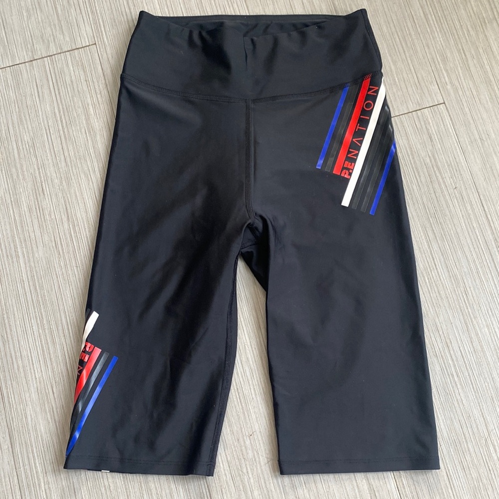 P.E. Nation bike shorts with red white and blue graphics